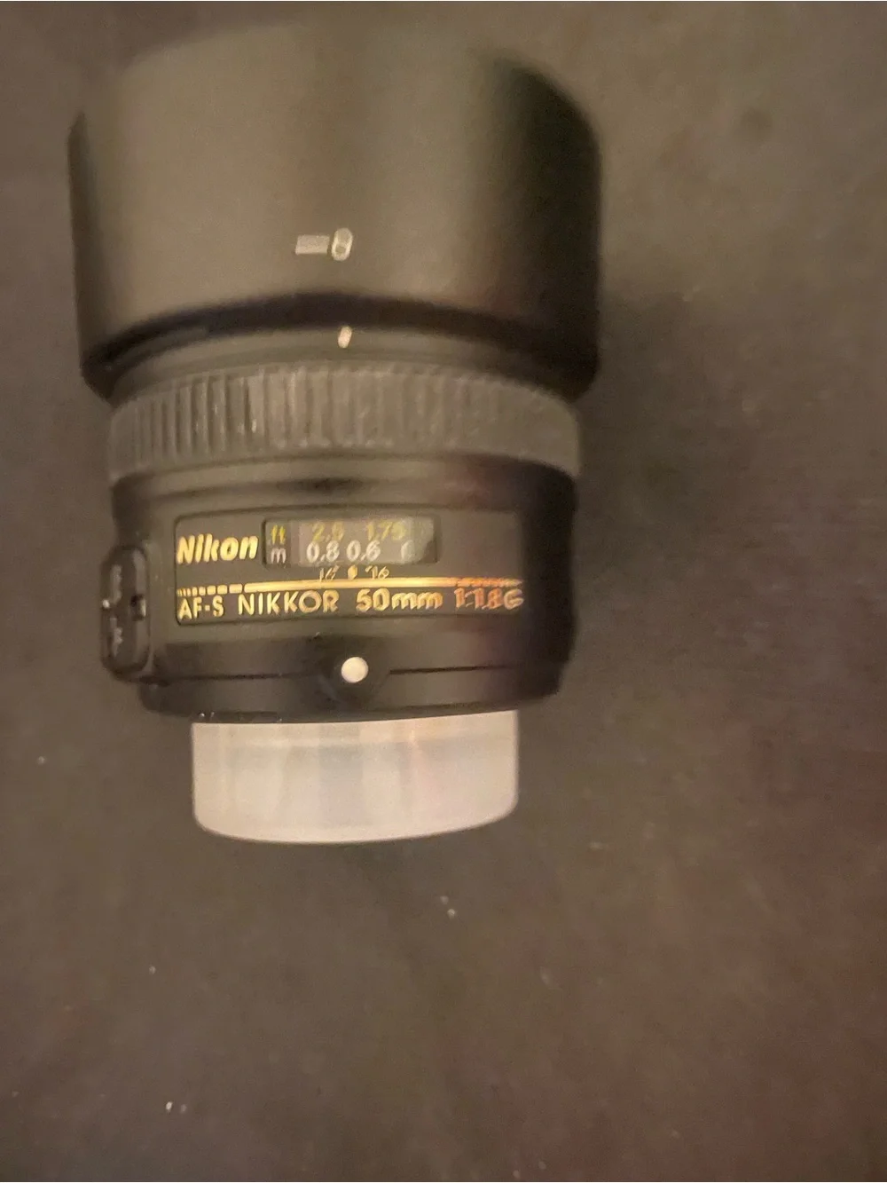 Nikon Black Lens with White Cap and Hood